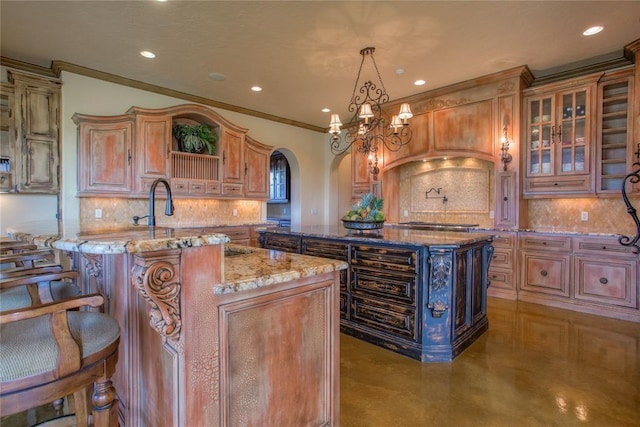 kitchen featuring backsplash, a center island with sink, light stone counters, arched walkways, and open shelves