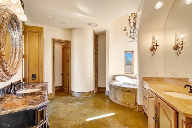 bathroom featuring a sink, visible vents, baseboards, and a bath