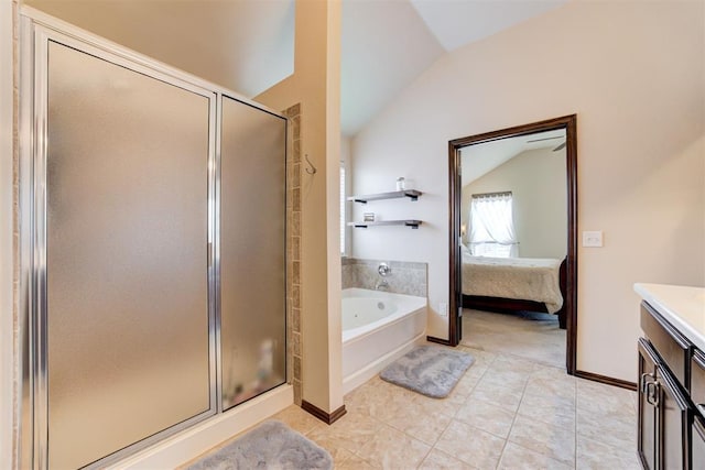 bathroom featuring connected bathroom, a garden tub, vaulted ceiling, a stall shower, and tile patterned floors