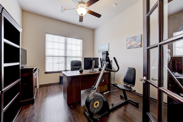 office area with visible vents, ceiling fan, and dark wood-style flooring