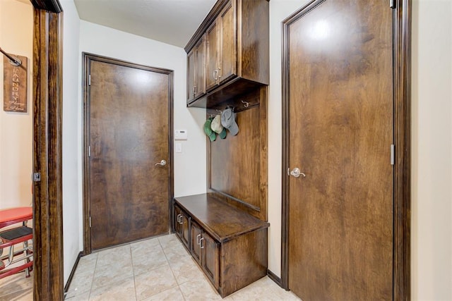 mudroom featuring light tile patterned flooring