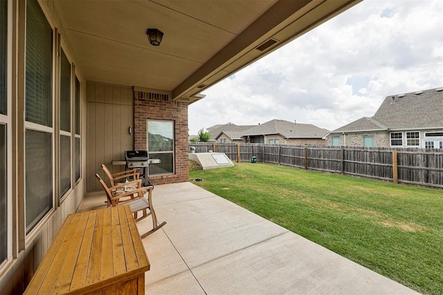 view of patio with a fenced backyard and grilling area