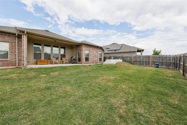 view of yard with a fenced backyard