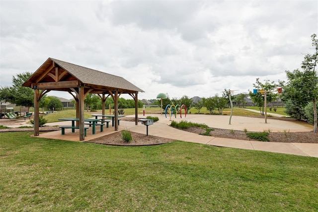 view of property's community with a gazebo, a yard, and playground community