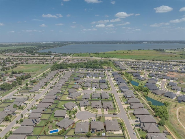 birds eye view of property featuring a residential view and a water view