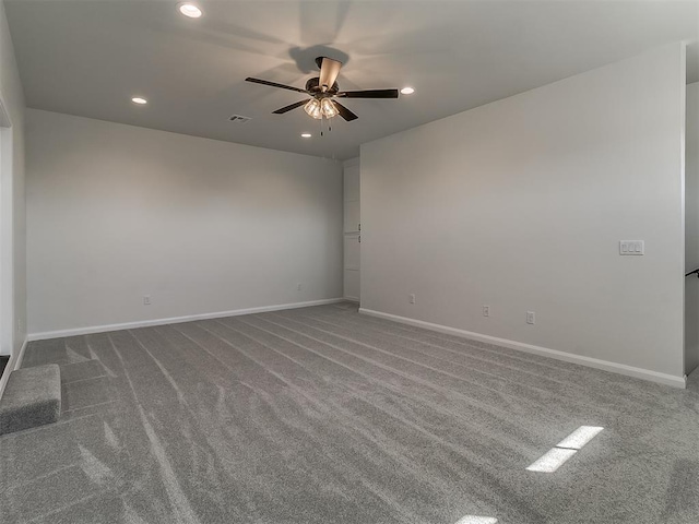 unfurnished room featuring a ceiling fan, baseboards, recessed lighting, and dark colored carpet