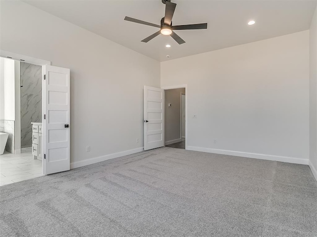 unfurnished bedroom featuring recessed lighting, carpet floors, and baseboards