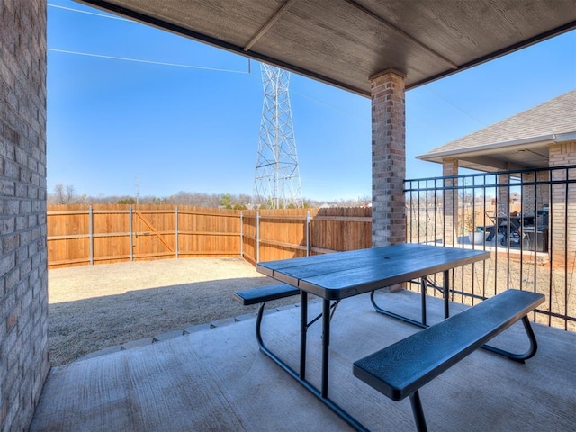 view of patio featuring fence