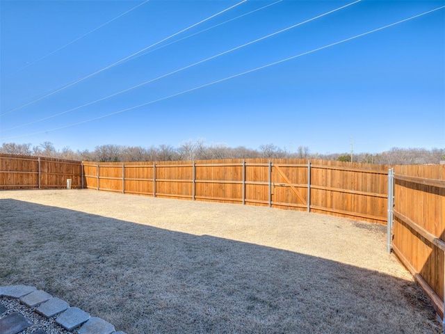 view of yard featuring a fenced backyard