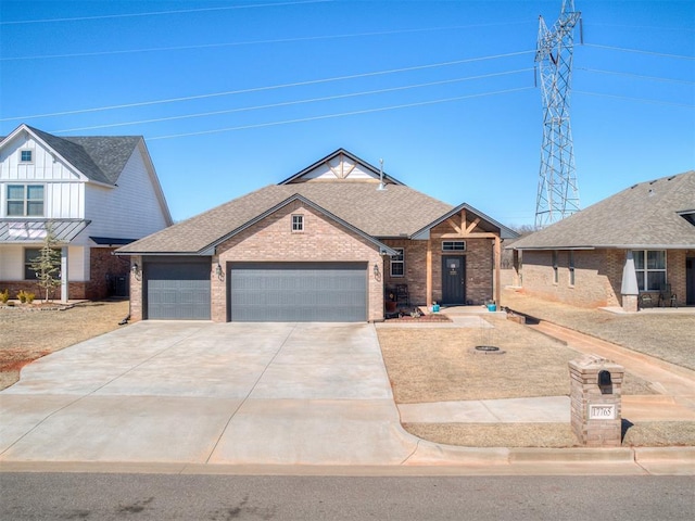 view of front of home featuring driveway, an attached garage, brick siding, and roof with shingles