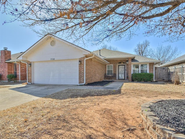 single story home featuring concrete driveway, a garage, fence, and brick siding