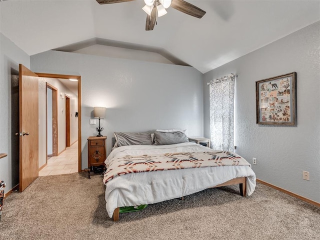 carpeted bedroom with lofted ceiling, a textured wall, baseboards, and ceiling fan