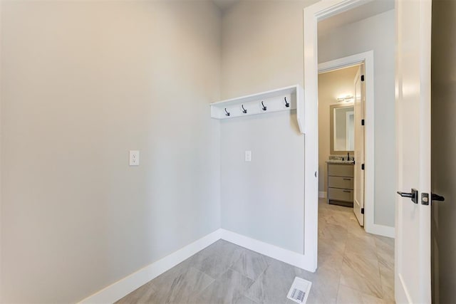 mudroom featuring visible vents and baseboards