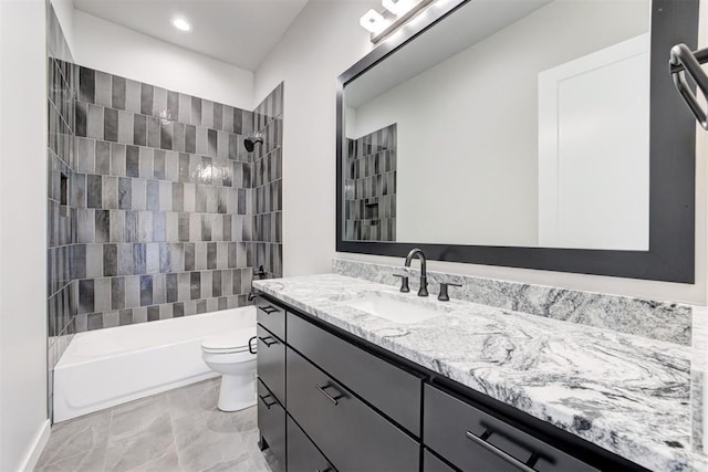 bathroom featuring toilet, bathtub / shower combination, and vanity