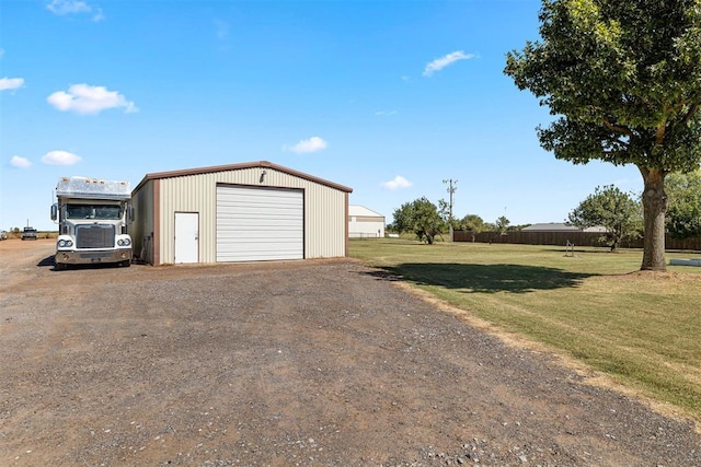 detached garage with dirt driveway