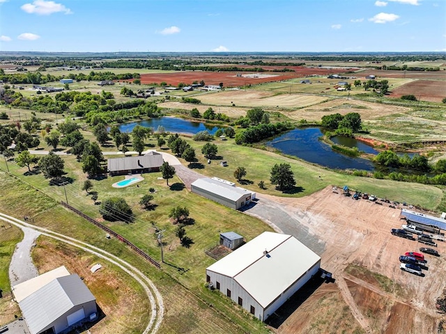 birds eye view of property with a water view and a rural view