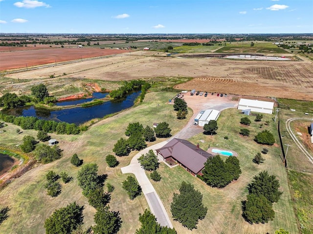 drone / aerial view with a water view and a rural view