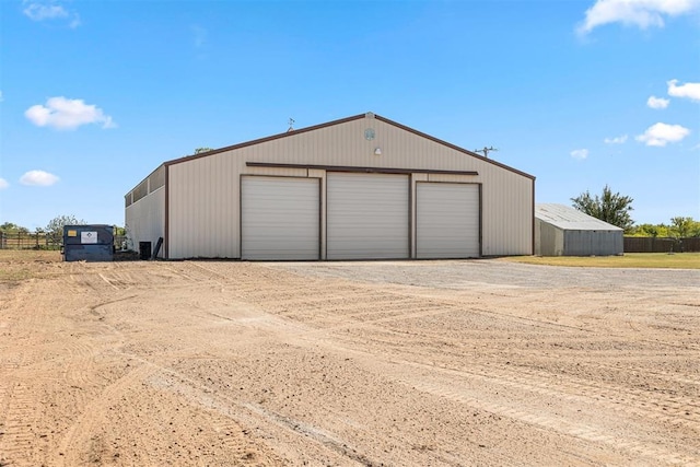 detached garage with fence