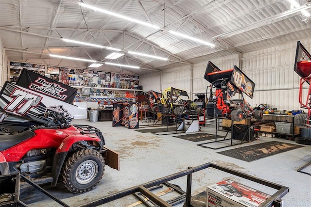 garage featuring a workshop area and metal wall