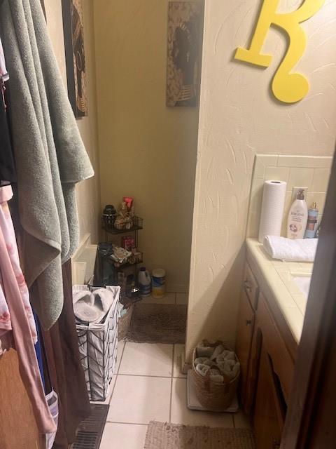 bathroom featuring vanity and tile patterned flooring