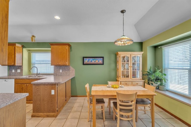 dining area with light tile patterned floors, recessed lighting, baseboards, and lofted ceiling