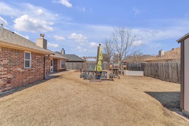 view of yard featuring a fenced backyard