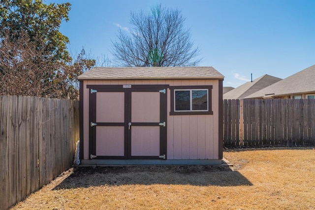 view of shed featuring a fenced backyard