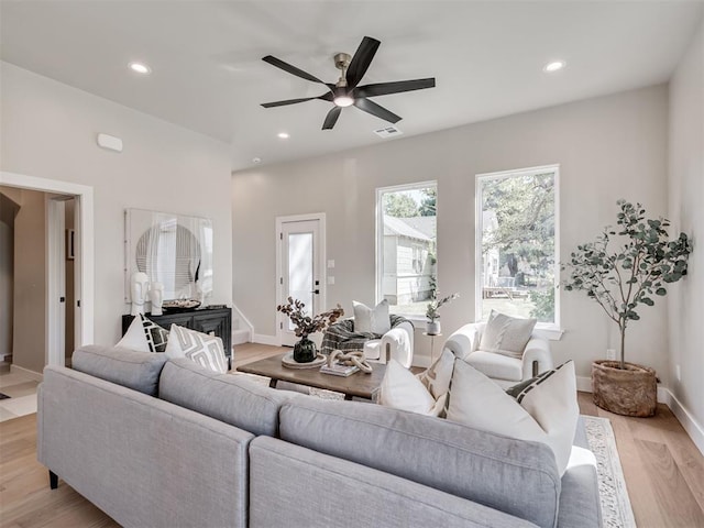 12 S Howard St, Edmond, OK 73003 - living area featuring a ceiling fan, visible vents, baseboards, recessed lighting, and light wood-style floors