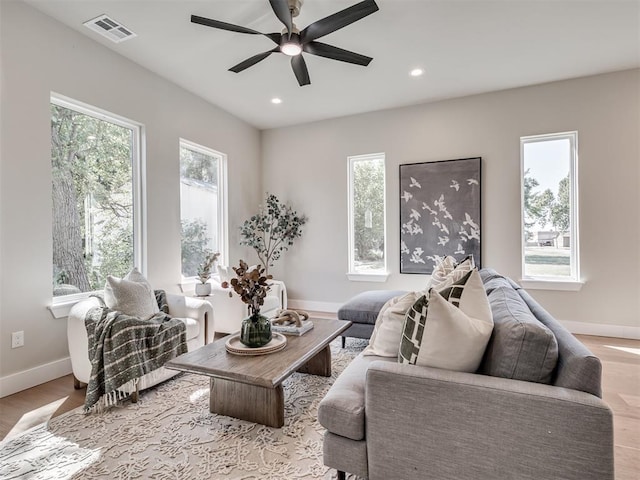 12 S Howard St, Edmond, OK 73003 - living area featuring recessed lighting, visible vents, a healthy amount of sunlight, and ceiling fan