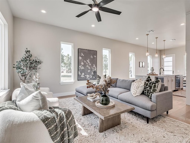 12 S Howard St, Edmond, OK 73003 - living area featuring recessed lighting, light wood-style floors, visible vents, and ceiling fan
