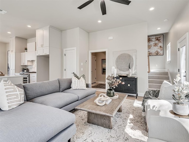 12 S Howard St, Edmond, OK 73003 - living room with visible vents, stairway, light wood-type flooring, recessed lighting, and a ceiling fan