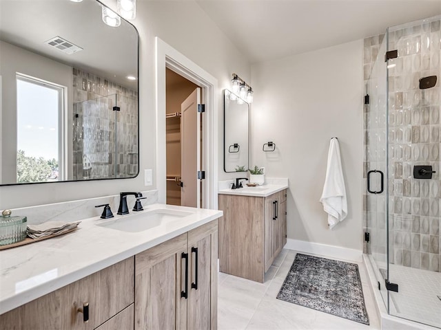 12 S Howard St, Edmond, OK 73003 - full bathroom featuring visible vents, a shower stall, and a sink