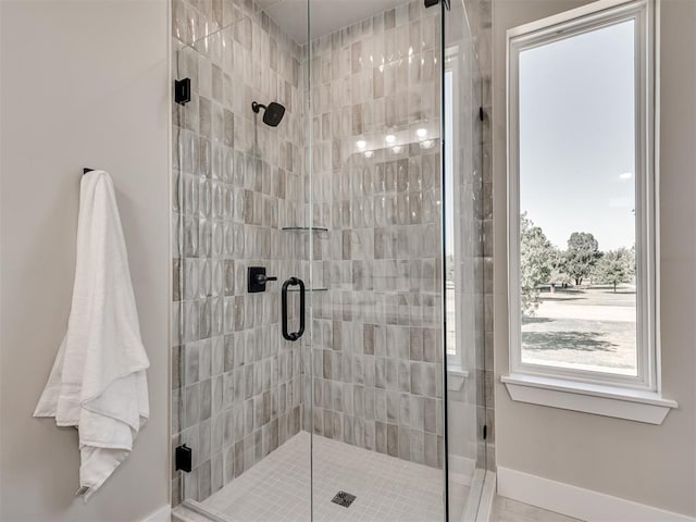 12 S Howard St, Edmond, OK 73003 - full bathroom with baseboards and a shower stall