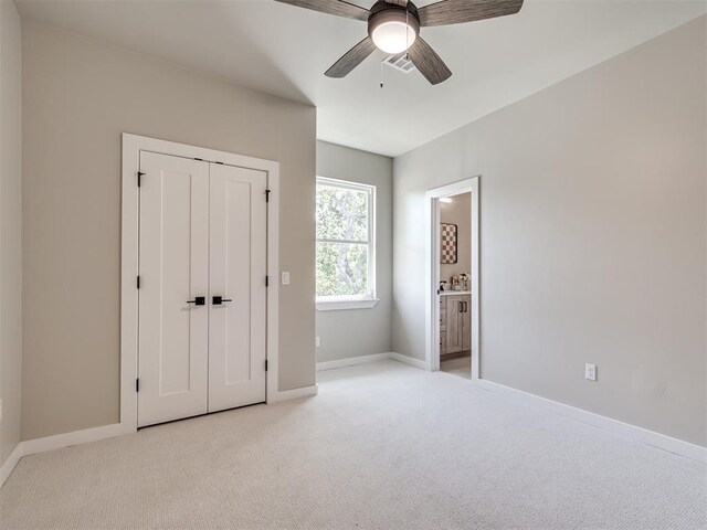12 S Howard St, Edmond, OK 73003 - unfurnished bedroom featuring visible vents, light carpet, and baseboards
