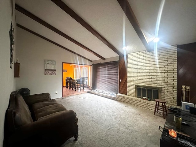 carpeted living room with a fireplace and vaulted ceiling with beams