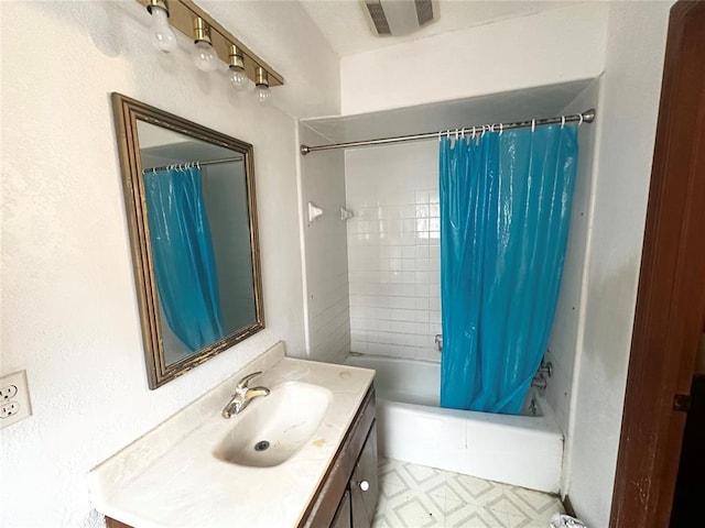 bathroom with vanity, tile patterned floors, shower / bathtub combination with curtain, and visible vents