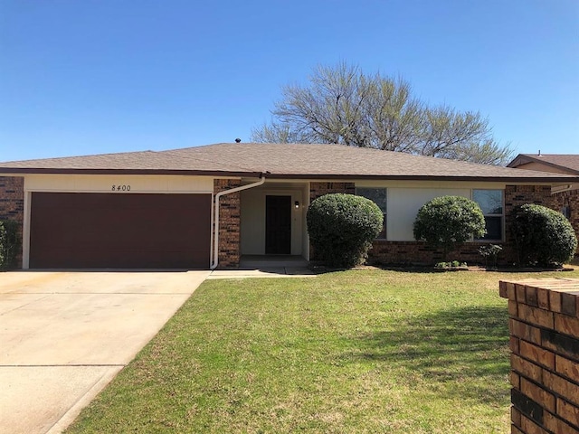 ranch-style house with a front lawn, concrete driveway, brick siding, and a garage