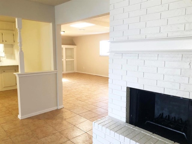 interior details with baseboards and a fireplace