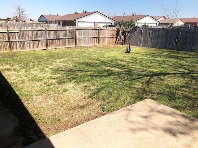 view of yard with a fenced backyard