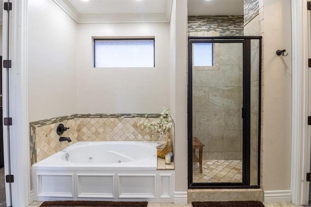 bathroom with a shower stall, a jetted tub, and crown molding