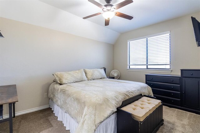 bedroom with light carpet, a ceiling fan, baseboards, and vaulted ceiling