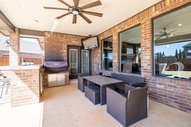 view of patio featuring an outdoor kitchen, outdoor wet bar, outdoor lounge area, and ceiling fan