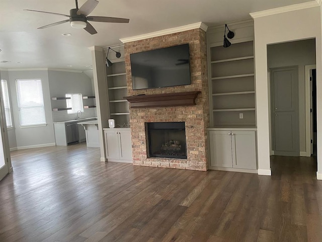 unfurnished living room featuring dark wood-style floors, a ceiling fan, and ornamental molding