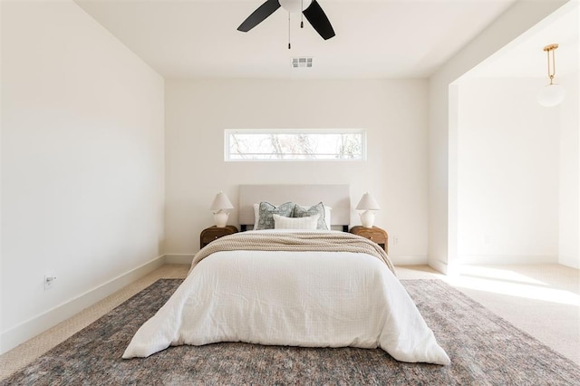 bedroom featuring visible vents, carpet flooring, and baseboards