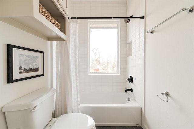 full bathroom featuring toilet and shower / bathtub combination with curtain