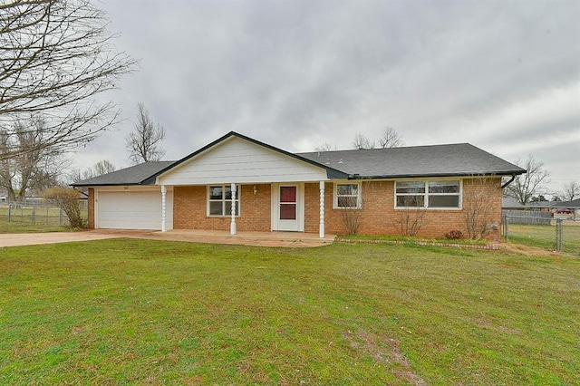 ranch-style house featuring brick siding, a front lawn, fence, driveway, and an attached garage