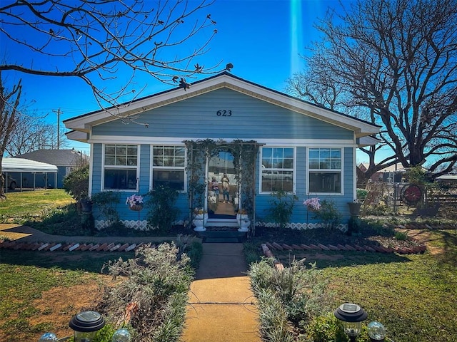 view of front of home with a front yard