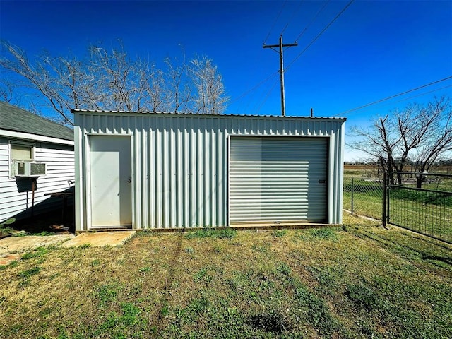 garage with cooling unit and fence