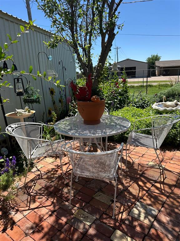 623 W 4th St, Grandfield, OK 73546 - view of patio / terrace featuring outdoor dining space