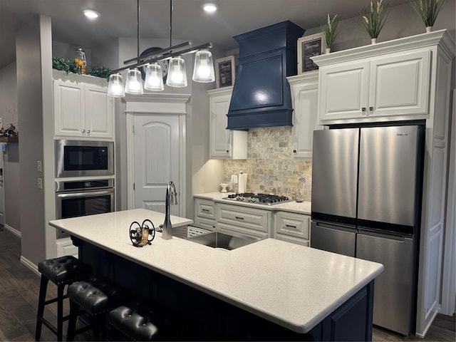 kitchen featuring backsplash, stainless steel appliances, light countertops, and custom range hood